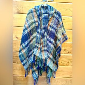 Cozy open-front poncho with hood and fringe